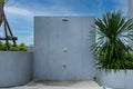 Outdoor shower at swimming pool. shower cabins behind outdoor swim pool .Outdoor shower area design at the beach, seaside or swimm Royalty Free Stock Photo