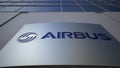 Outdoor signage board with Airbus logo. Modern office building. Editorial 3D rendering