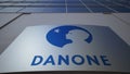 Outdoor signage board with Danone logo. Modern office building. Editorial 3D rendering