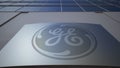 Outdoor signage board with General Electric logo. Modern office building. Editorial 3D rendering