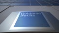 Outdoor signage board with The Goldman Sachs Group, Inc. logo. Modern office building. Editorial 3D rendering Royalty Free Stock Photo