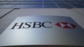 Outdoor signage board with HSBC logo. Modern office building. Editorial 3D rendering