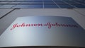 Outdoor signage board with Johnson`s logo. Modern office building. Editorial 3D rendering