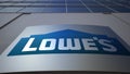 Outdoor signage board with Lowe`s logo. Modern office building. Editorial 3D rendering