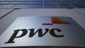 Outdoor signage board with PricewaterhouseCoopers PwC logo. Modern office building. Editorial 3D rendering Royalty Free Stock Photo