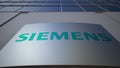 Outdoor signage board with Siemens logo. Modern office building. Editorial 3D rendering
