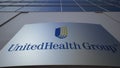 Outdoor signage board with UnitedHealth Group logo. Modern office building. Editorial 3D rendering Royalty Free Stock Photo