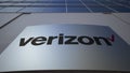 Outdoor signage board with Verizon Communications logo. Modern office building. Editorial 3D rendering