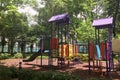 Outdoor slide playground equipment in city public park Royalty Free Stock Photo