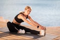 Outdoor Sports. Happy Fit Middle Aged Woman Doing Stretching Exercises Outside Royalty Free Stock Photo