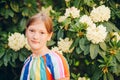 Outdoor spring portrait of sweet little 10 year old girl