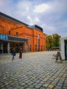 Outdoor square of Old Brewery shopping mall with facade of red brick building Royalty Free Stock Photo