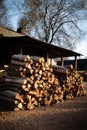 Outdoor stack firewood, country rural house with woodpile external. Woodpile backyard.