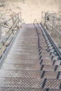 Outdoor staircase against dry sunlit ground near Lake Austin in Texas Royalty Free Stock Photo
