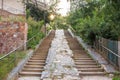 Outdoor staircase with two flights of stairs stairwells up and down in direction of movement of the sunrise. Concept of choice d