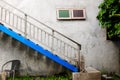 Outdoor stairway and blue clour withl wall texture on vintage st Royalty Free Stock Photo