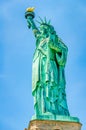 The outdoor Statue of Liberty on a clear blue sky background on Liberty Island, New York, USA Royalty Free Stock Photo