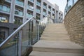 Outdoor stone staircase. Stone steps of old staircase with stainless steel. Royalty Free Stock Photo