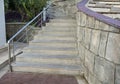 Outdoor stone staircase. Stone steps of old staircase with stainless steel. Royalty Free Stock Photo