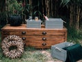 Outdoor storage with a chest of drawers with decorative accessories situated in the yard