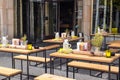 Outdoor street cafe with tables set for customers