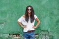 Outdoor street portrait of stylish woman in sunglasses and casua