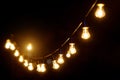 Outdoor string lights hanging on a line in backyard Royalty Free Stock Photo