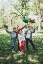 Outdoor student party. Group of smiling cheerful girl friends celebrating a party with balloons in park Royalty Free Stock Photo