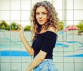 Outdoor Summer Fashionable sensual portrait of a beautiful brunette girl with long hair posing, having fun near the Royalty Free Stock Photo