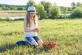 Outdoor summer portrait of little girl with basket strawberries