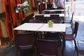 outdoor summer restaurant terrace with tables and wickered chairs closeup photo Royalty Free Stock Photo