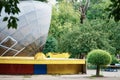 Outdoor summer scene in the city amusement park. A functioning small concert venue. Side view. Rounded spherical roof in Royalty Free Stock Photo