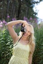 Outdoor summer smiling lifestyle portrait of pretty young blonde Royalty Free Stock Photo