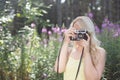 Outdoor summer smiling lifestyle portrait of pretty young blonde Royalty Free Stock Photo