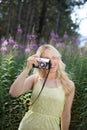 Outdoor summer smiling lifestyle portrait of pretty young blonde Royalty Free Stock Photo