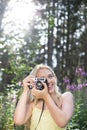 Outdoor summer smiling lifestyle portrait of pretty young blonde Royalty Free Stock Photo