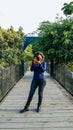 Outdoor summer smiling lifestyle portrait of pretty young woman having fun in the city of Lima taking pictures Royalty Free Stock Photo