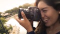 Outdoor summer smiling lifestyle portrait of pretty young woman having fun in the city of Lima taking pictures Royalty Free Stock Photo