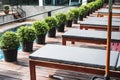 Outdoor sunbathing deck chair at resort swimming pool