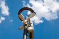 Outdoor surveillance cameras on lamppost with led lantern against blue sky Royalty Free Stock Photo