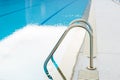 Outdoor swimming pool with stair in a building Royalty Free Stock Photo