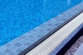 Outdoor swimming pool steps with clear water surface background, nobody, underwater pattern blue background with grid tiles, Royalty Free Stock Photo