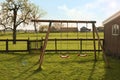 Outdoor swings near building on spring day Royalty Free Stock Photo