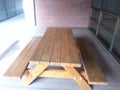 Outdoor table with bench