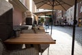 Outdoor table and chair without people in front of cafe, bar, and restaurant in walking street old town DÃÂ¼sseldorf, Germany. Royalty Free Stock Photo