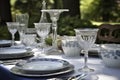 outdoor table setting with elegant china and silverware for formal dinner Royalty Free Stock Photo