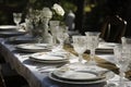 outdoor table setting with elegant china and silverware for formal dinner Royalty Free Stock Photo