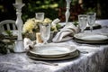 outdoor table setting with elegant china and silverware for formal dinner Royalty Free Stock Photo