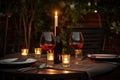 outdoor table settings with wine glasses and bottle of red, for a romantic evening Royalty Free Stock Photo