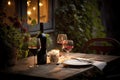 outdoor table settings with wine glasses and bottle of red, for a romantic evening Royalty Free Stock Photo